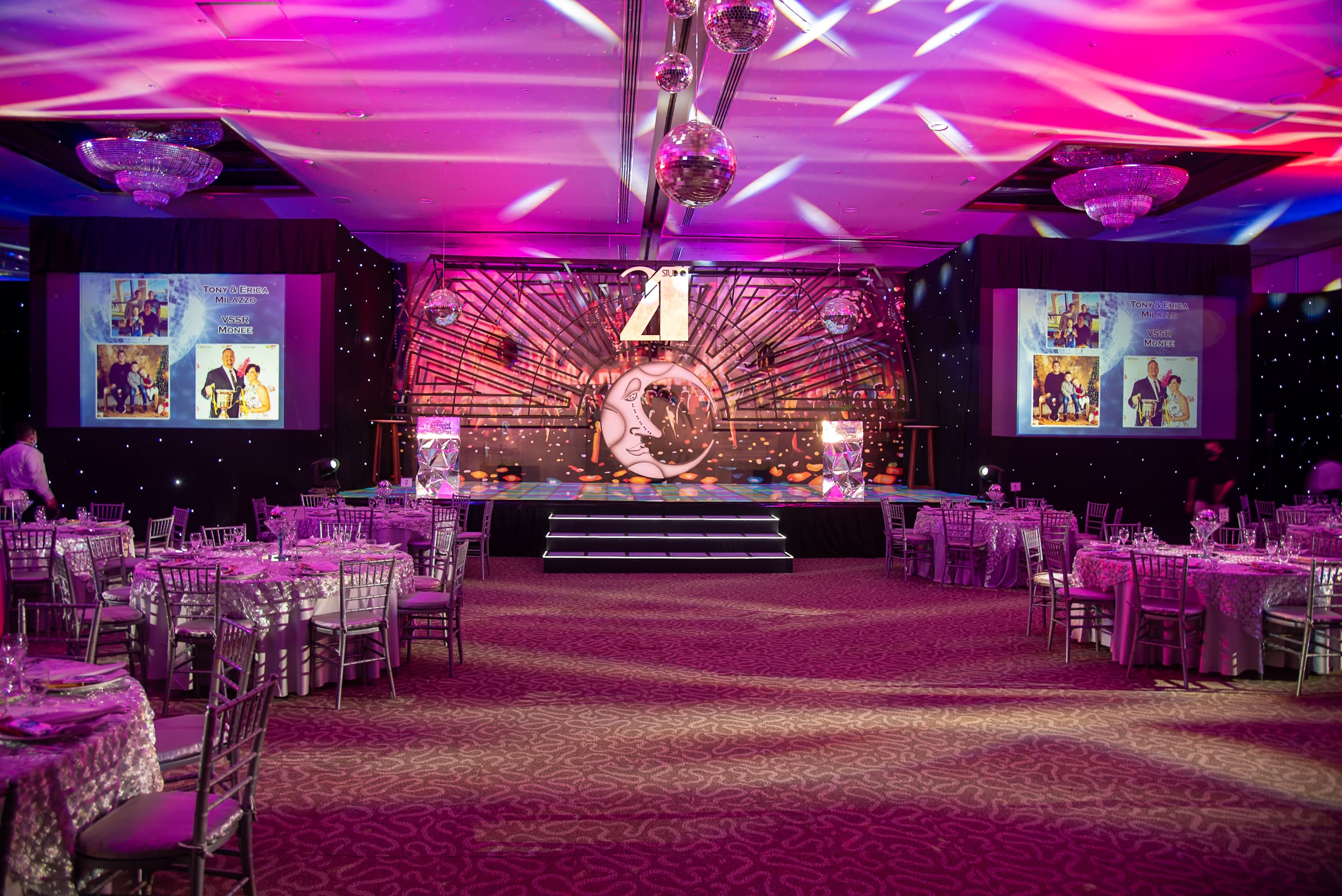 A large, beautifully lit corporate event hall